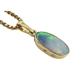 Gold oval opal pendant, on gold box link necklace, both 9ct