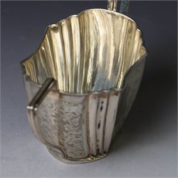 Late Victorian silver twin handled open sucrier and milk jug, of fluted form with panels of engraved foliate decoration, hallmarked D & M Davis, London 1896