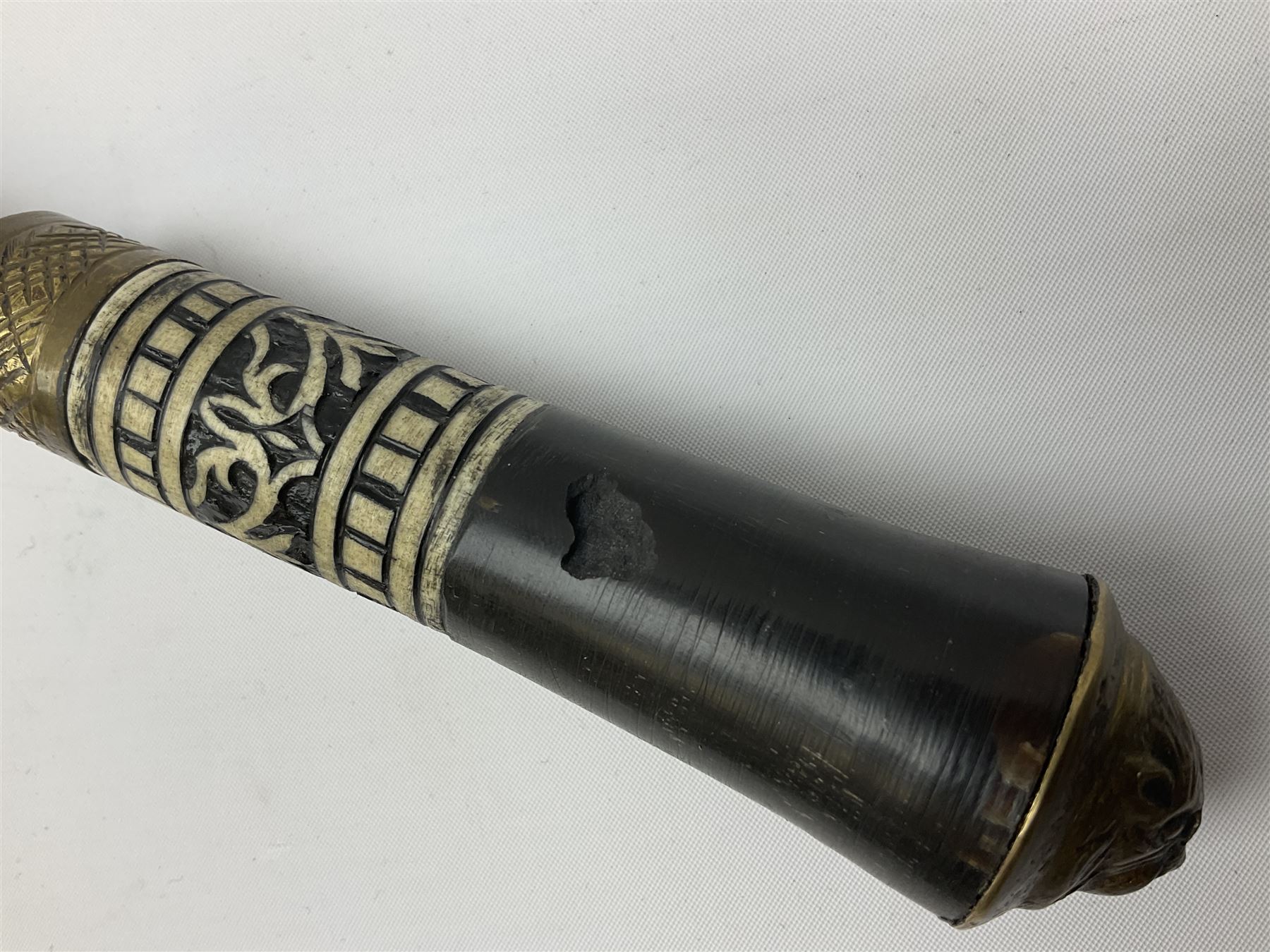
Late 19th/early 20th century Anglo Indian ebony and bone sword stick with 62cm steel blade, brass locking ferrule and lion mask pommel L92 cm.