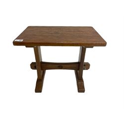 Acornman - oak occasional or side table, rectangular adzed top on shaped end supports joined by pegged stretcher on sledge feet, by Alan Grainger of Brandsby