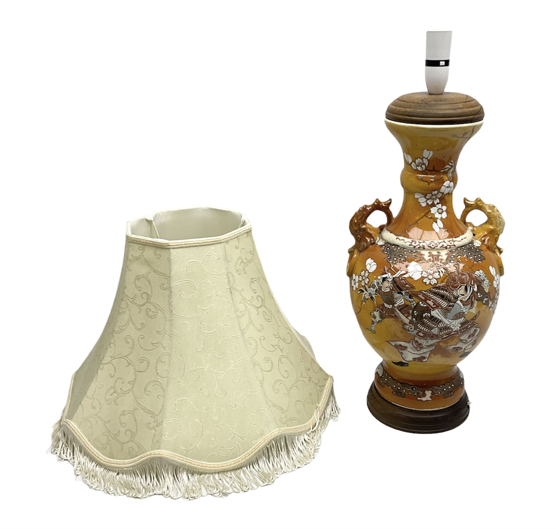 20th century Japanese vase converted to a lamp, the baluster form body decorated with samurai warriors and blossoming branches with twin handles, with wood base and fixtures, with tasselled fabric shade, H56cm excl shade