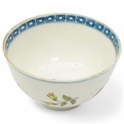 Worcester tea bowl and saucer, c.1770, painted with polychromatic floral sprays within blue borders, bearing crescent marks to base, with another similar early example, unmarked