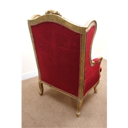  French upholstered wing back chair, the gilt frame with scroll carved cresting and acanthus arms, serpentine frieze on cabriole legs, loose seat cushion, W76cm, D68cm, H123cm  