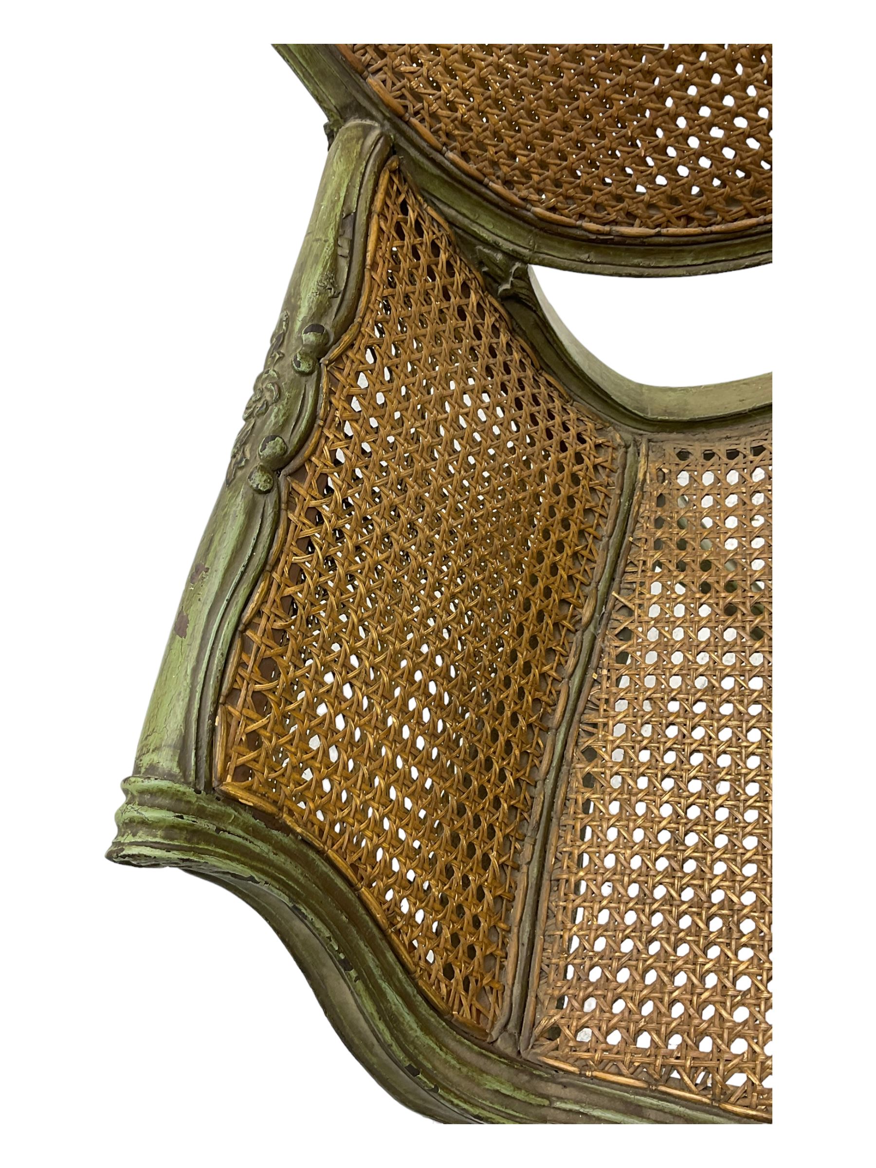 19th century French Louis XV-design armchair, carved and painted wood frame, caned back and seat with scrolled arms, supported by cabriole supports with acanthus leaf decoration