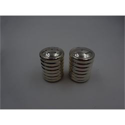 Pair of modern silver salt and pepper shakers, of cylindrical form, each with ridged band decoration, hallmarked Laurence R Watson & Co, Birmingham 2003, H 4cm, boxed 