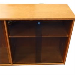 Light oak bookcase cabinet, fitted with four sliding tinted glass doors