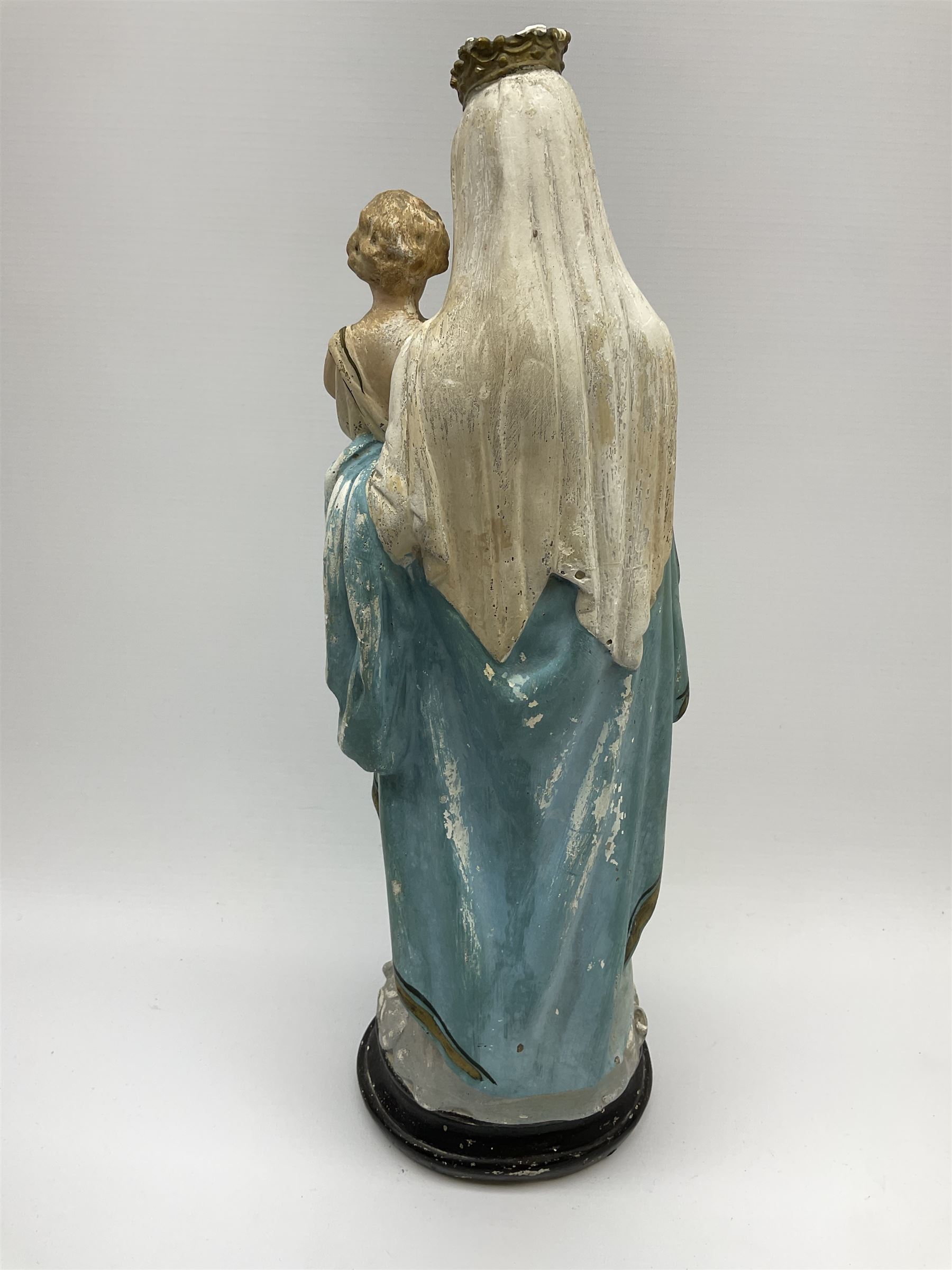 An early 20th century painted plaster figure modelled as Madonna and ...