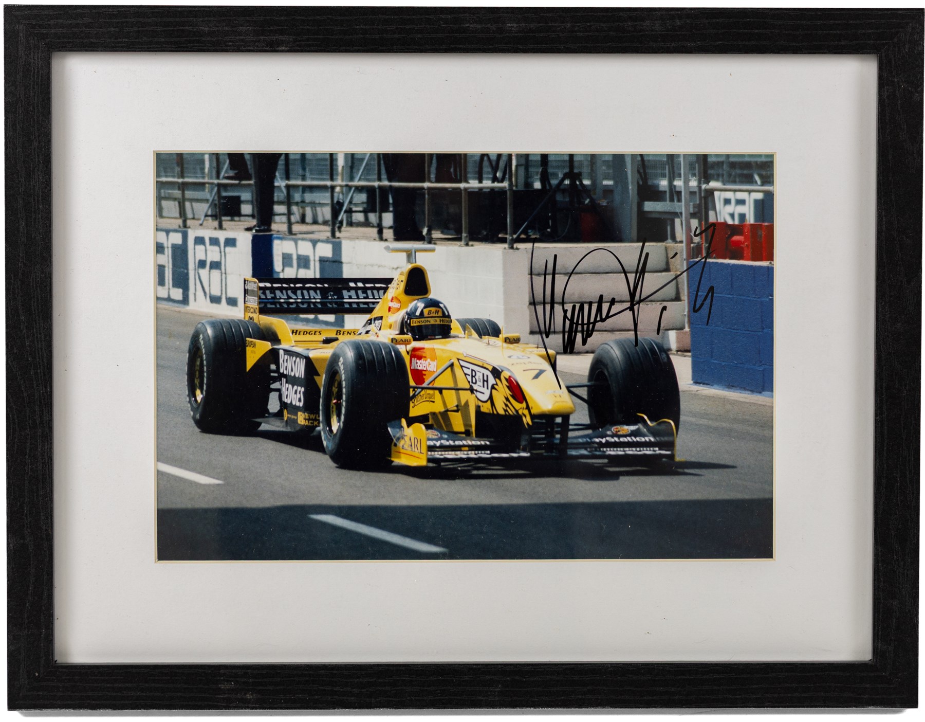 Ten signed Formula 1 photographs, comprising eight Damon Hill examples, Jenson Button and a Nigel Mansell example, nine with certificates of authenticity from Write Stuff Autographs, all framed, largest H47cm, W67cm