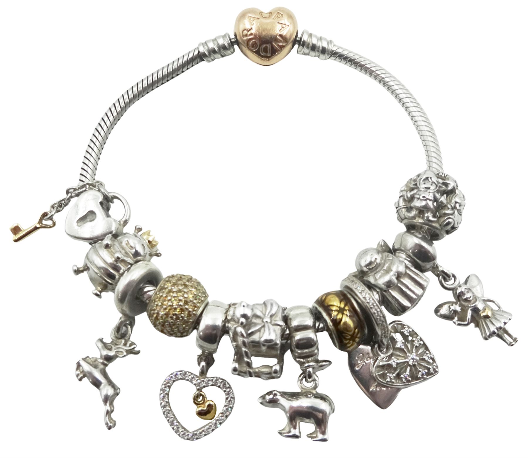 Silver Pandora bracelet with 14ct gold plated heart clasp, with twelve Pandora charms, including Santa's sleigh, Christmas elves, reindeer, fairy, snowflake and polar bear, some with 14ct gold plated accents, with Pandora box and bag