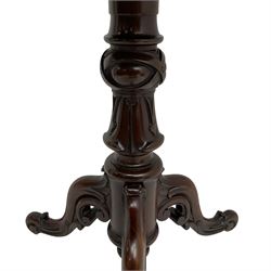 Victorian figured mahogany tripod table, octagonal top with segmented highly figured veneers over pointed arch frieze rails, on turned egg and dart carved pedestal with lappet carved baluster, three splayed and C-scroll carved supports with scrolled terminals