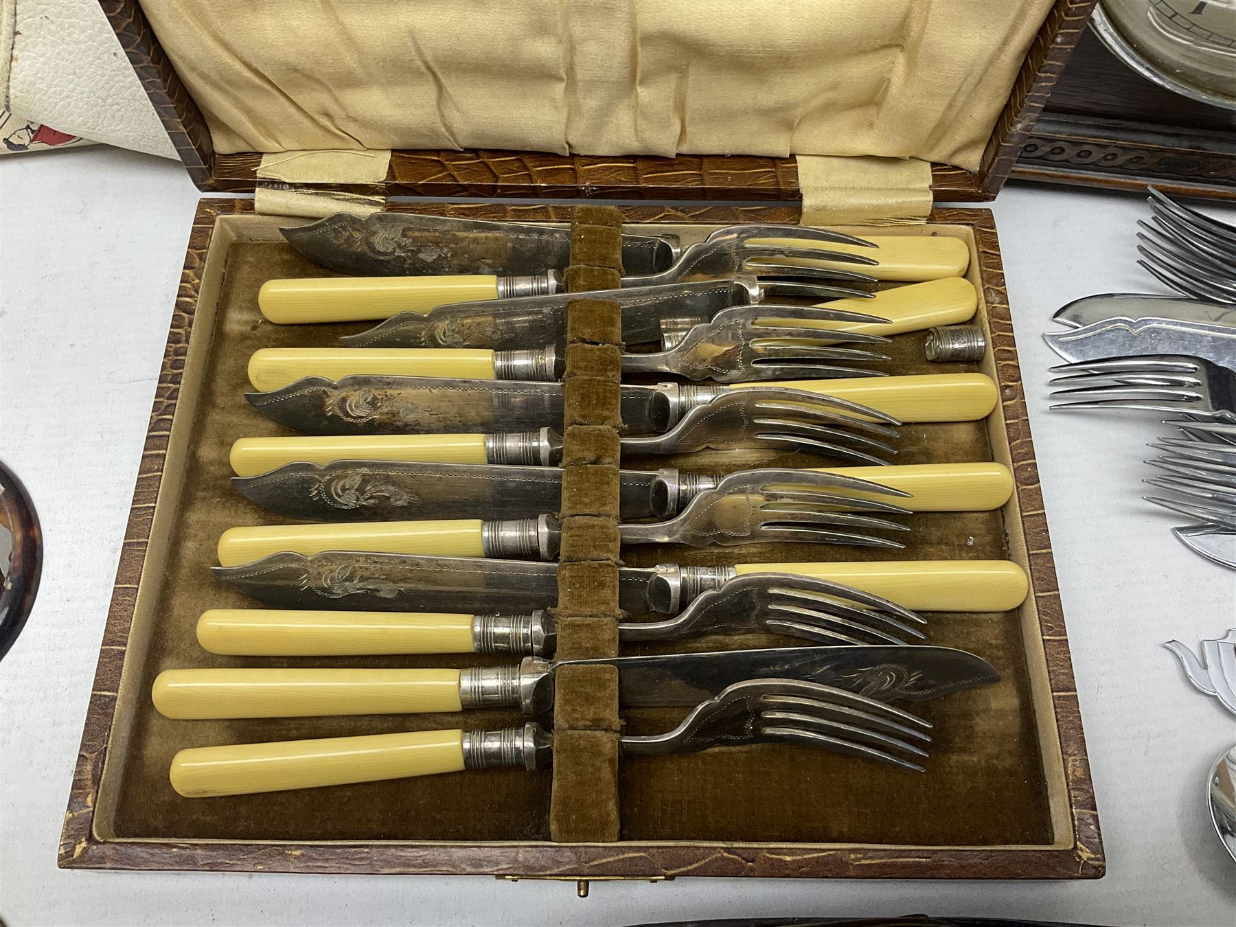 Mid 20th century cigarette box in the form of a gondola, the faux tortoiseshell with mother of pearl inlay (a/f), cased mantel clock with silvered numerical dial, oak lidded tea jar caddy, oak box, silver-plate cutlery, quantity of records, Smith's empire miniature clock, stamps etc