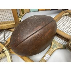 Quantity of early 20th century and later tennis rackets, to include Artus Majesty, Dunlop Alpha, Atlas Silver Shield and Raleigh Konni, together with a stitched rugby ball