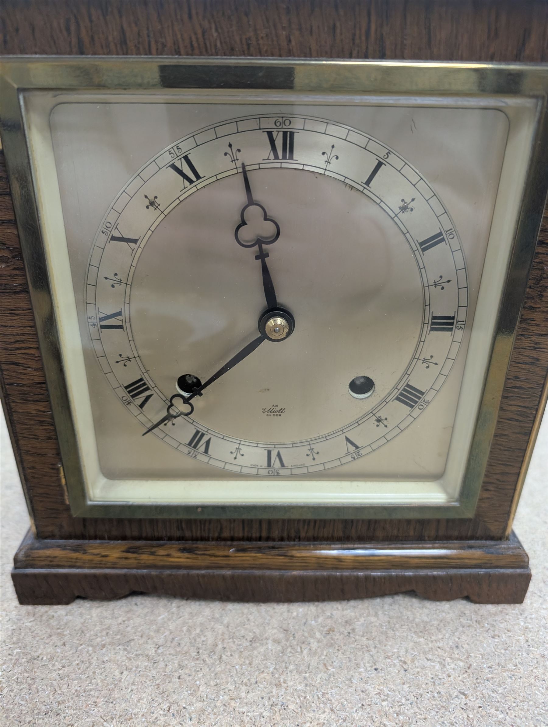 Two wooden mantel clocks, including Elliott example and a brass cased Holosteric Barometer