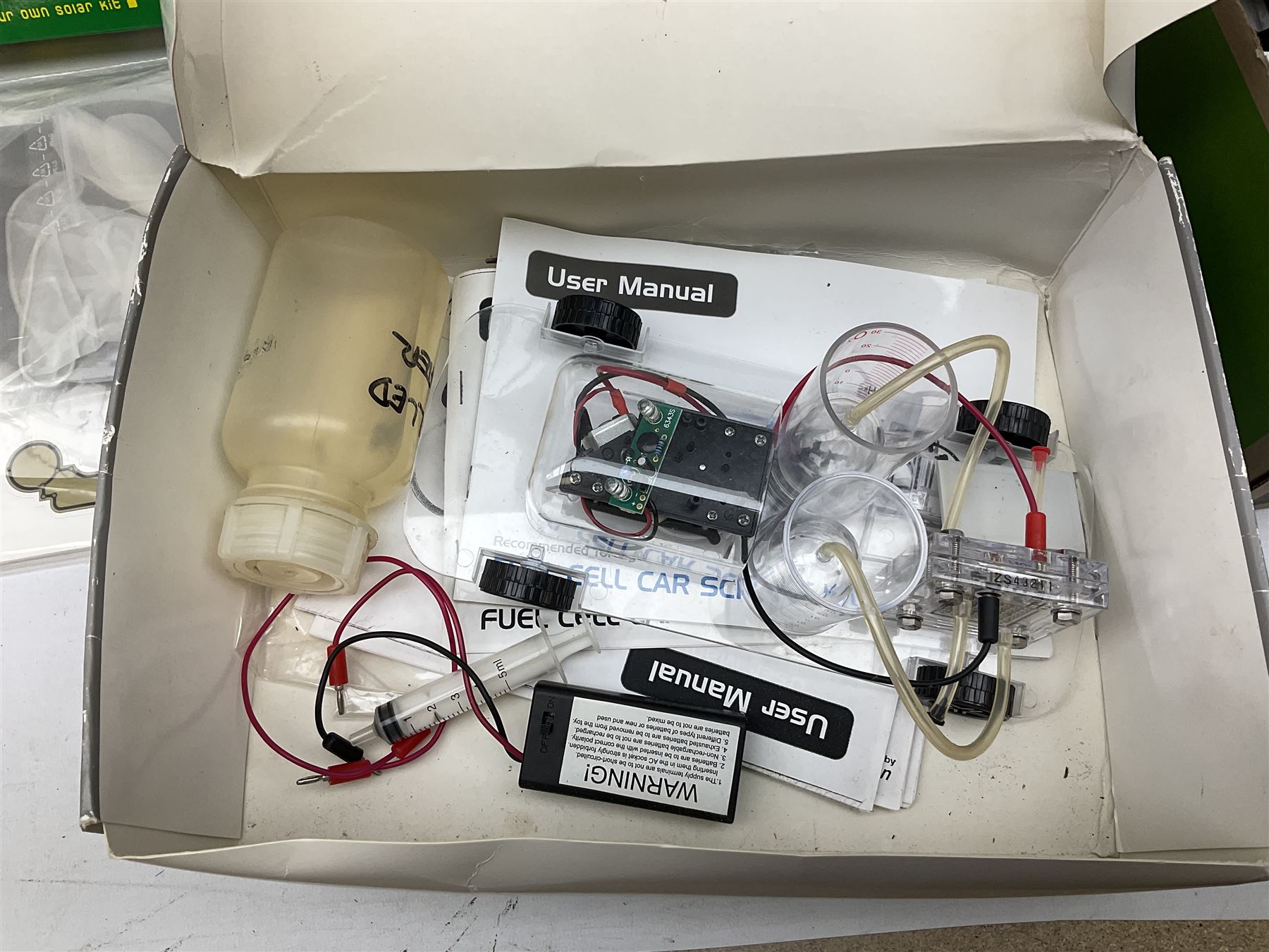 Scientific toys including Electronic Experiment Kit; Fuel Cell Car Science Kit; Robot Kits 6-in-1 Educational Solar Kit; all boxed; remote control helicopter; and two others