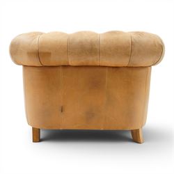 Alexander James - Chesterfield tan armchair, button backed with scrolled arms, brass studded trim raised on light wood turned feet