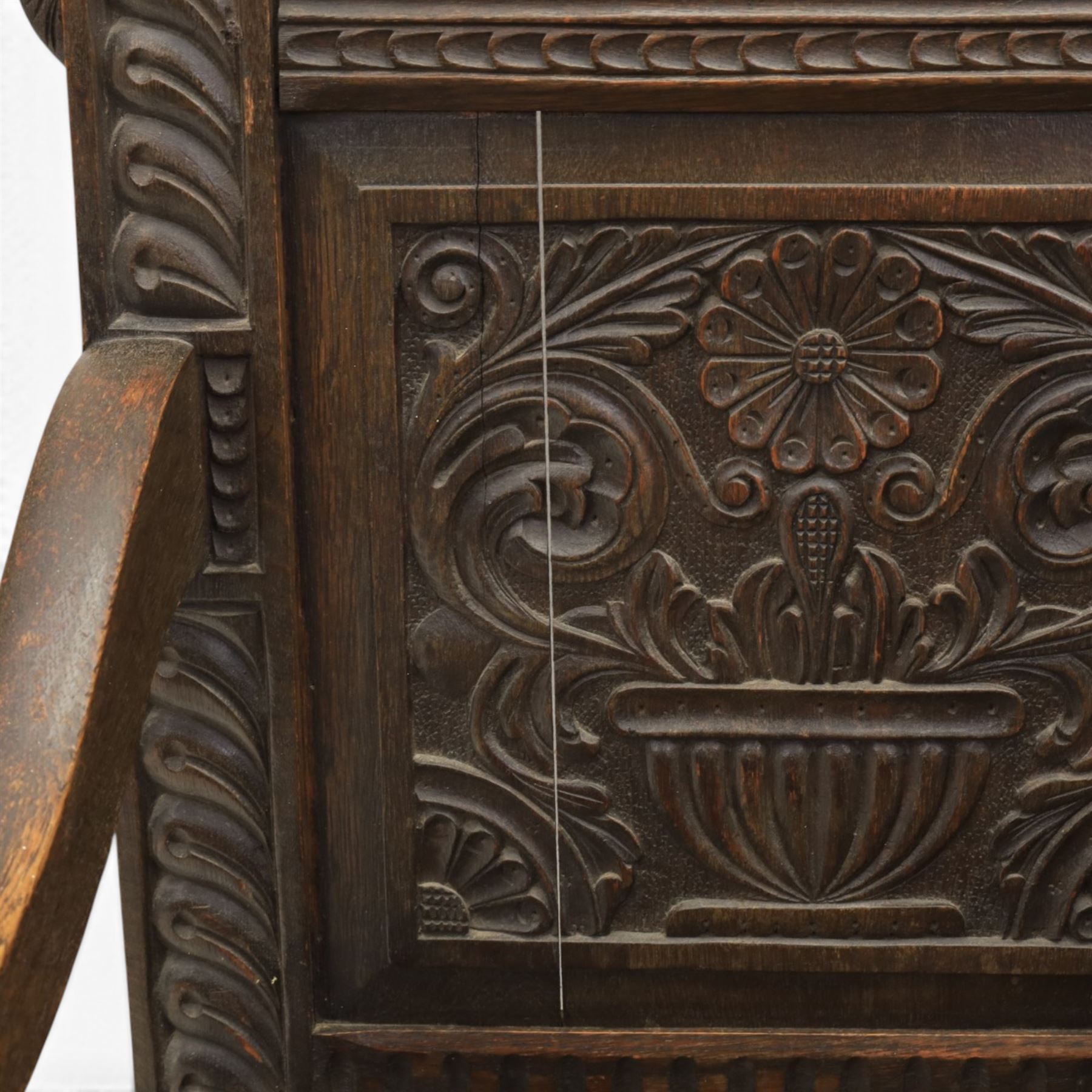 17th century style carved oak Wainscott chair, intricately carved back, united by a turned stretcher