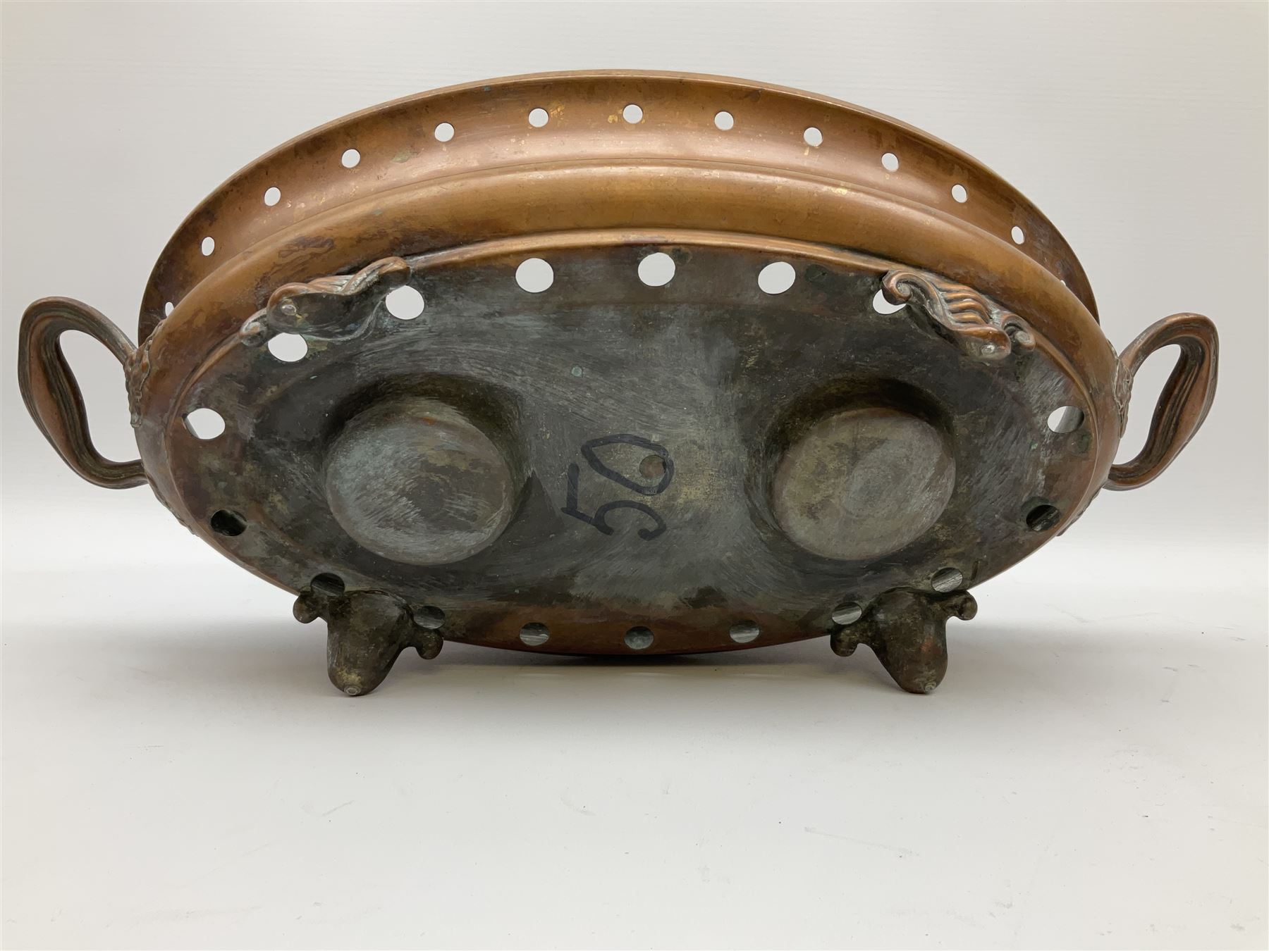 Agricultural copper corn funnel, H32.5cm, another similar copper funnel and copper warming platter of oval form, with twin handles on four supports, with removeable warming plate, L49cm