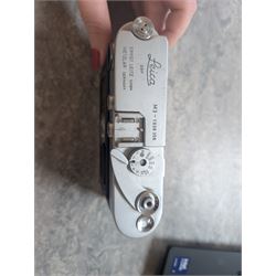 Leica DBP M3 35mm rangefinder camera body, serial no. 1038356, circa 1961, in chrome finish, housed in brown leather Leica case, with a Leitz Wetzlar Sunnilux 1:1.4/50 lens serial no. 1845148, Leitz Wetzlar Elmar 1:4/135 lens serial no. 1825980, 12575N hood, 12521G hood, Leica Meter MC serial no. 99015, Sunpak Auto28 SR Thyristor, Linhof 3 Way Pan tripod, and a Toshiba PE-1 Linear Exposure meter, all housed in an Original Benser Everready Case, most items with instruction booklets 