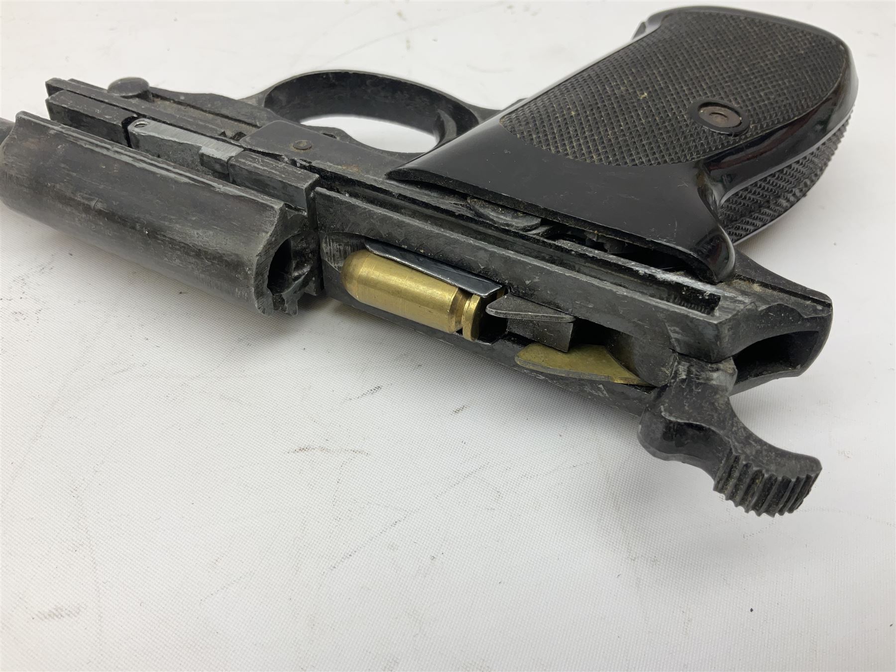 Modern Remington .44 calibre percussion brass framed army revolver, possibly by Uberti, with 16cm octagonal barrel, No.225; partially deactivated to old specification with no certificate L36cm overall; together with a die-cast copy part model of a Walther P38 semi automatic pistol (2) RFD ONLY