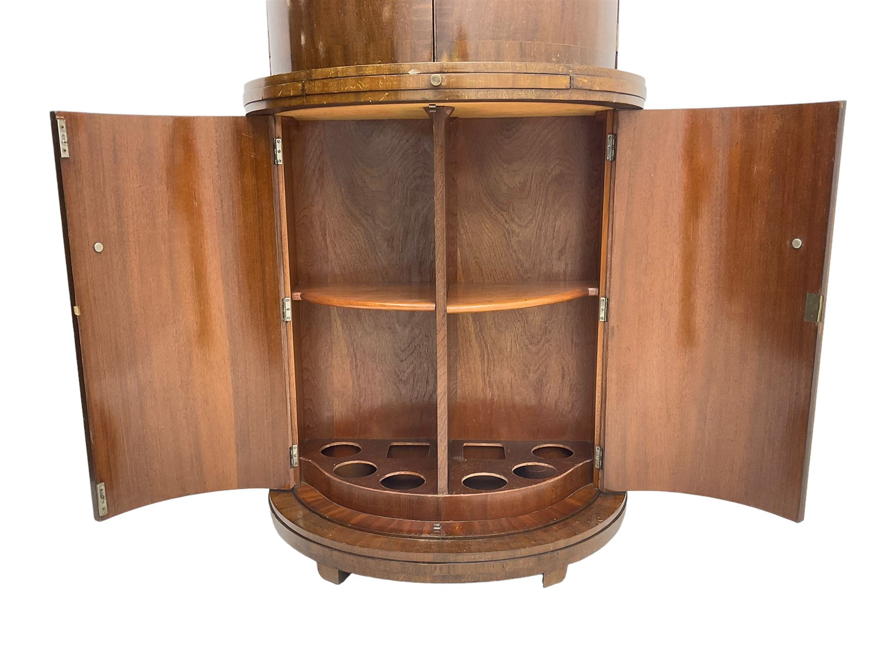 1930s Art Deco walnut demi-lune cocktail cabinet, enclosed by four curved doors, the upper section with mirrored interior, glass shelf and glass holders, the lower section fitted with shelves and bottle holders