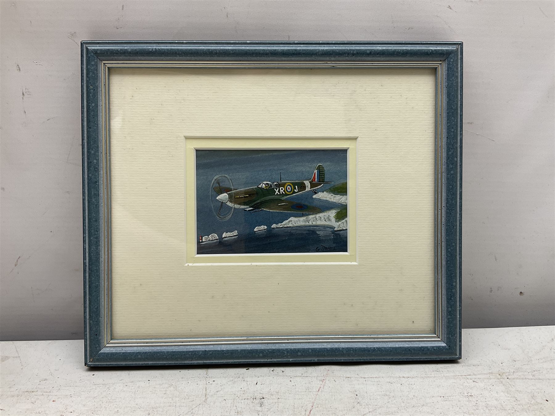 G Davis (British 20th century): 'Spitfire over the Needles', watercolour signed, titled verso 6cm x 9cm