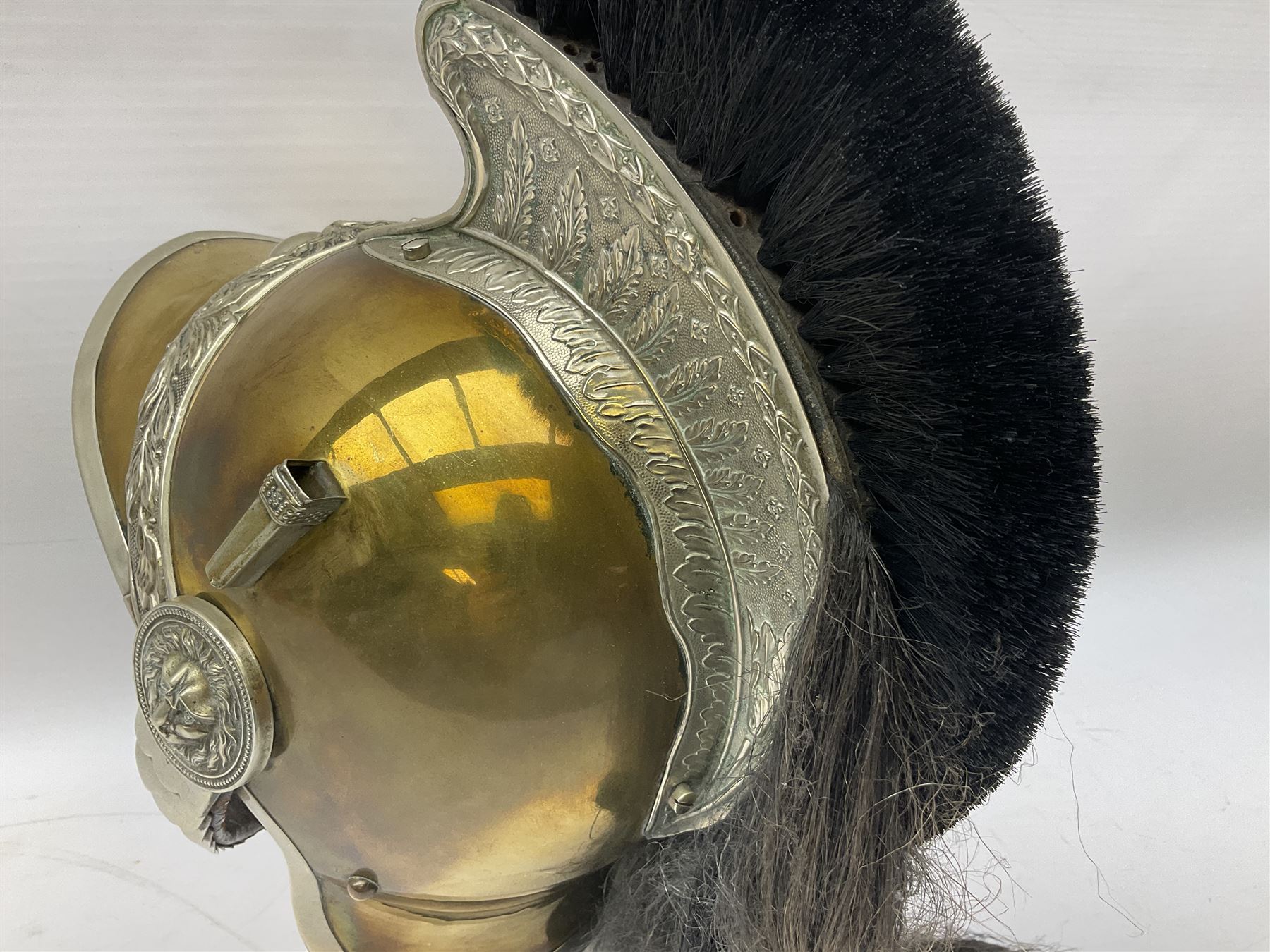 French Model 1913 mounted gendarmerie helmet; brass bodied with nickel mounts, chin strap, comb and horse-hair H27cm (no liner)