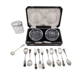  Group of silver, comprising pair of cut glass butter dishes with two silver butter knives, in fitted case, retailed by Harrods London, a George III Fiddle pattern mustard spoon, hallmarked William Eaton, London 1830, glass jar with hallmarked silver lid and continental flatware, including set of six teaspoons, pair of teaspoons and three forks, all with rose finials, stamped 800 and 835, etc
