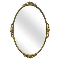 Oval gilt wall mirror, with bevelled edge plate within a moulded frame cast with acanthus ...