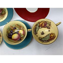 Group of Aynsley ceramics decorated with Orchard Gold pattern, comprising light blue trio, red cup and saucer, trinket dish and small vase, vase H5cm