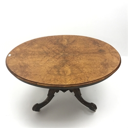  Victorian walnut oval tilt-top salon table with quarter veneered burr walnut top, turned column on four scrolling supports on castors, W98cm, H72cm, D98cm  