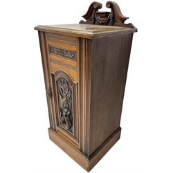 Edwardian bedside cabinet, raised broken swan pediment back, single panelled cupboard door decorated with applied carved seahorse motif and foliate patterns