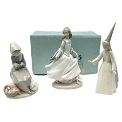 Lladro figures, Cinderella no.4828, Duck seller no.1267 and Fairy godmother no. 4595, all with printed mark beneath 