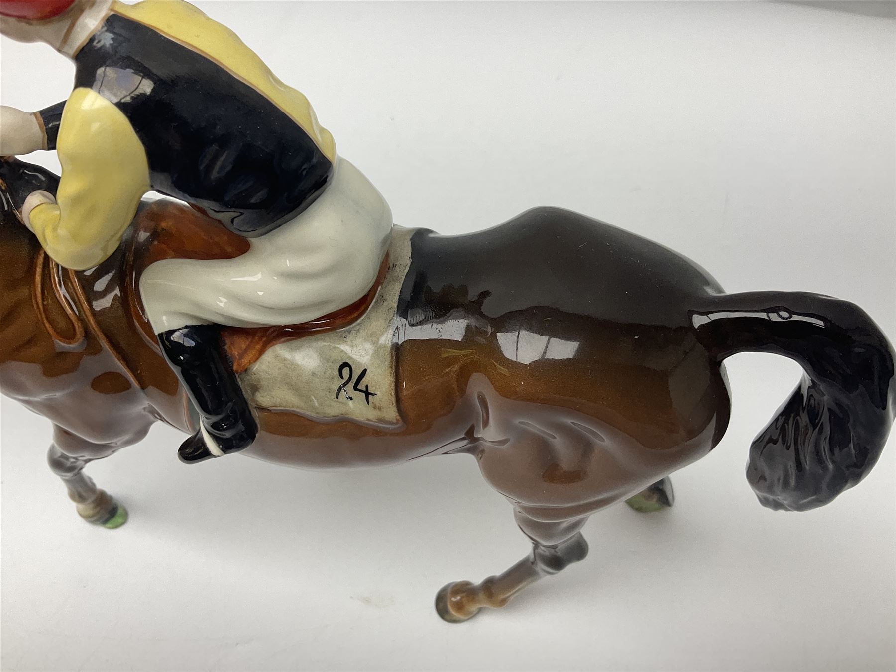 Beswick jockey on walking horse no 1037, in black white and yellow jockey colours, with printed mark beneath, H22cm