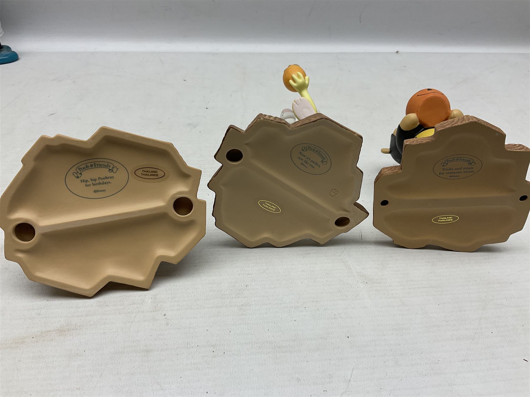 Collection of eight Disney Pooh and Friends figures, comprising Hip, hip Poohray for birthdays, Tricks and treats for someone sweet, We'll share forever whatever the weather, Thanks for being a Caring Sort of Bear, Now it's perfect just like you, Have a red-shirt red letter day, Life is sweet and I love you Mama, all with boxes