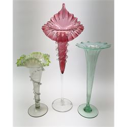 A Victorian Vaseline glass trumpet vase, with crimped rim and trailed frilled decoration, H26cm, together with a 20th century example, and a Victorian cranberry glass Jack-in-the-pulpit vase. (3). 