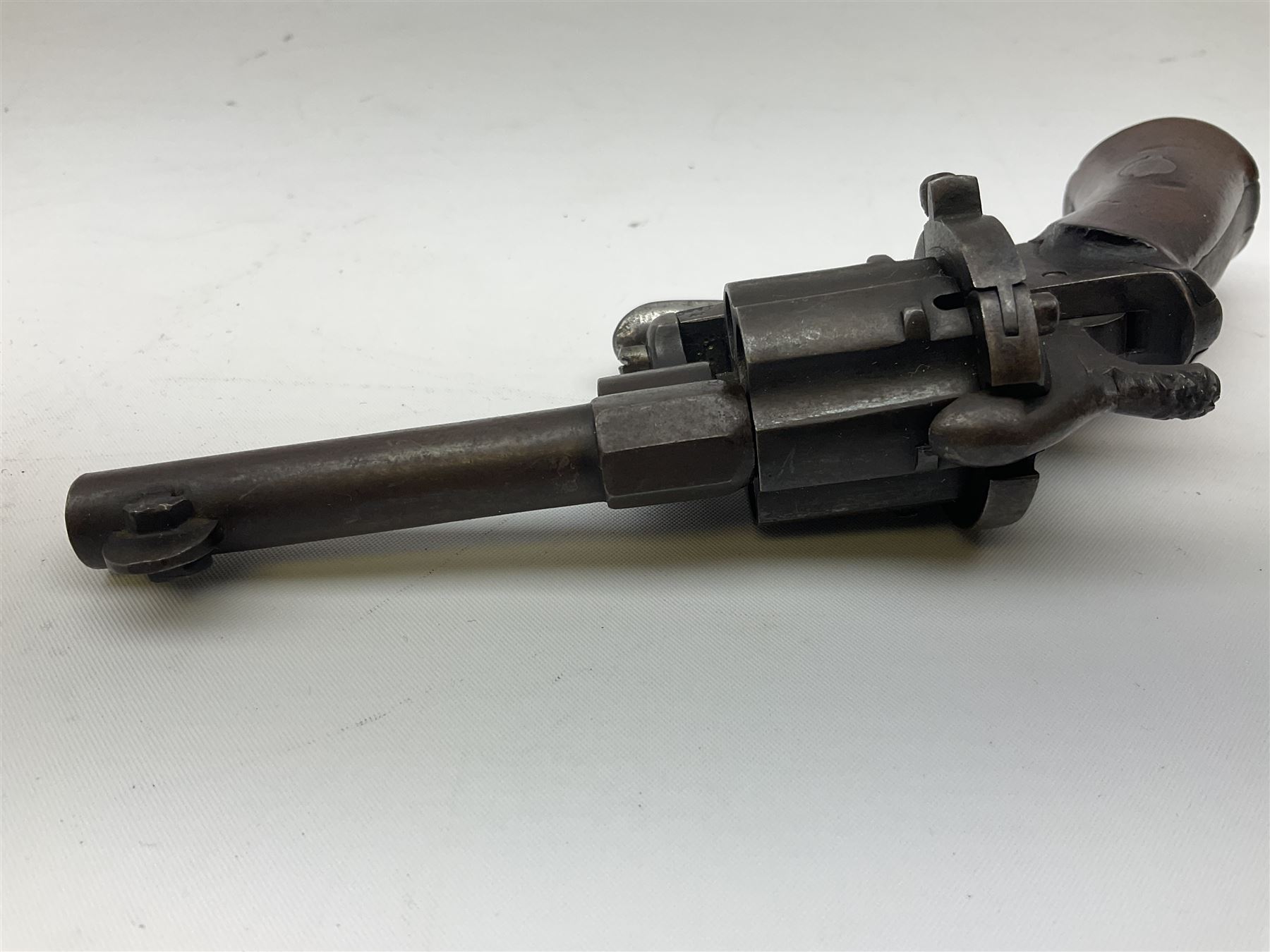 19th century Belgian Flobert 7mm pin-fire revolver with six-shot cylinder, 7cm octagonal to round barrel, folding trigger and walnut stock incorporating ejector rod in butt L18cm overall