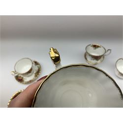 Royal Albert Old Country Roses pattern tea set, comprising teapot, coffee pot, six teacups and six saucers, five side plates, further teacup with joined saucer and side plate, open sucrier, milk jug, cake plate, and preserve pot and cover, together with Royal Albert Jubilee Rose pattern sauce boat and stand, and Royal Albert Lavender Rose pattern cake stand. 