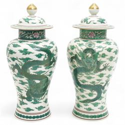 Pair of Chinese 20th century famille verte vases and covers, decorated with dragons among ...