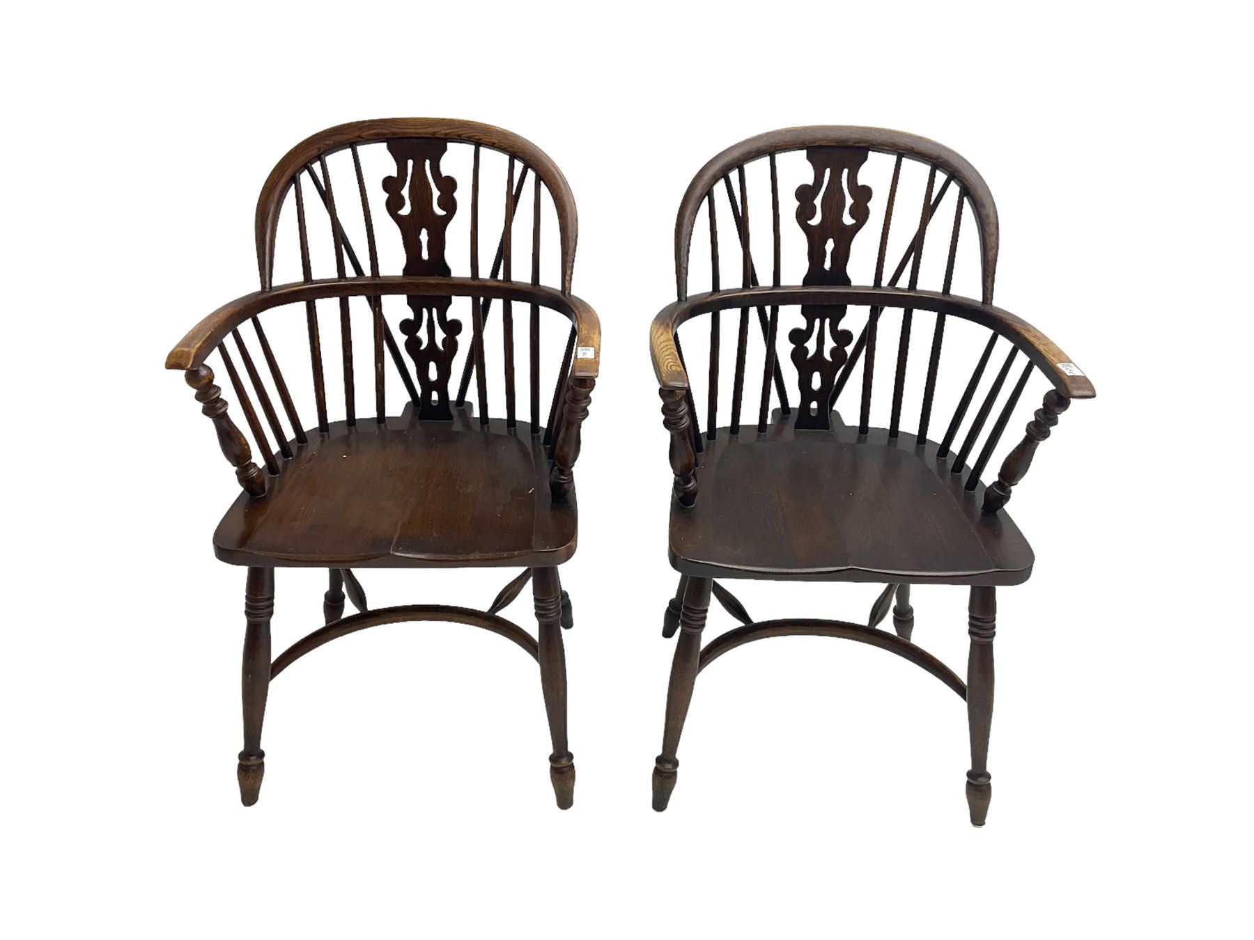 Pair late 20th century oak Windsor elbow chairs, double hoop and stick back with pierced and fretwork work splat, dished seat on turned supports joined by crinoline stretcher