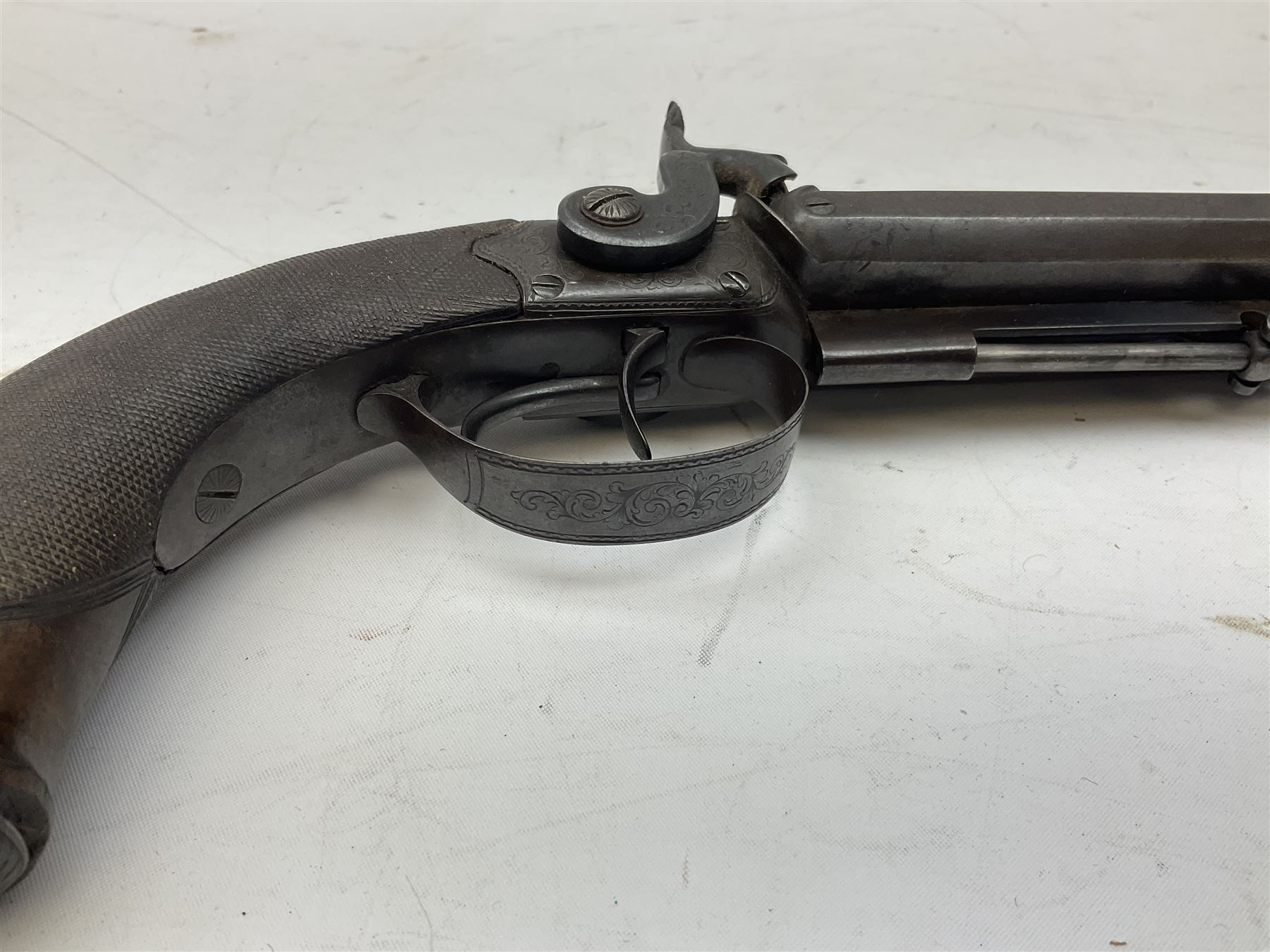 Early 19c percussion double barrel Howdah pistol by J. Blisset London, c1840s, approximately 50 calibre, 10.5cm octagonal monobloc barrels with captive swivel ramrod under, finely chequered walnut stock, engraved hammers, lock plates, tang and trigger guard, butt plate with hinged cap compartment, vacant white metal oval escutcheon L25.5cm overall
