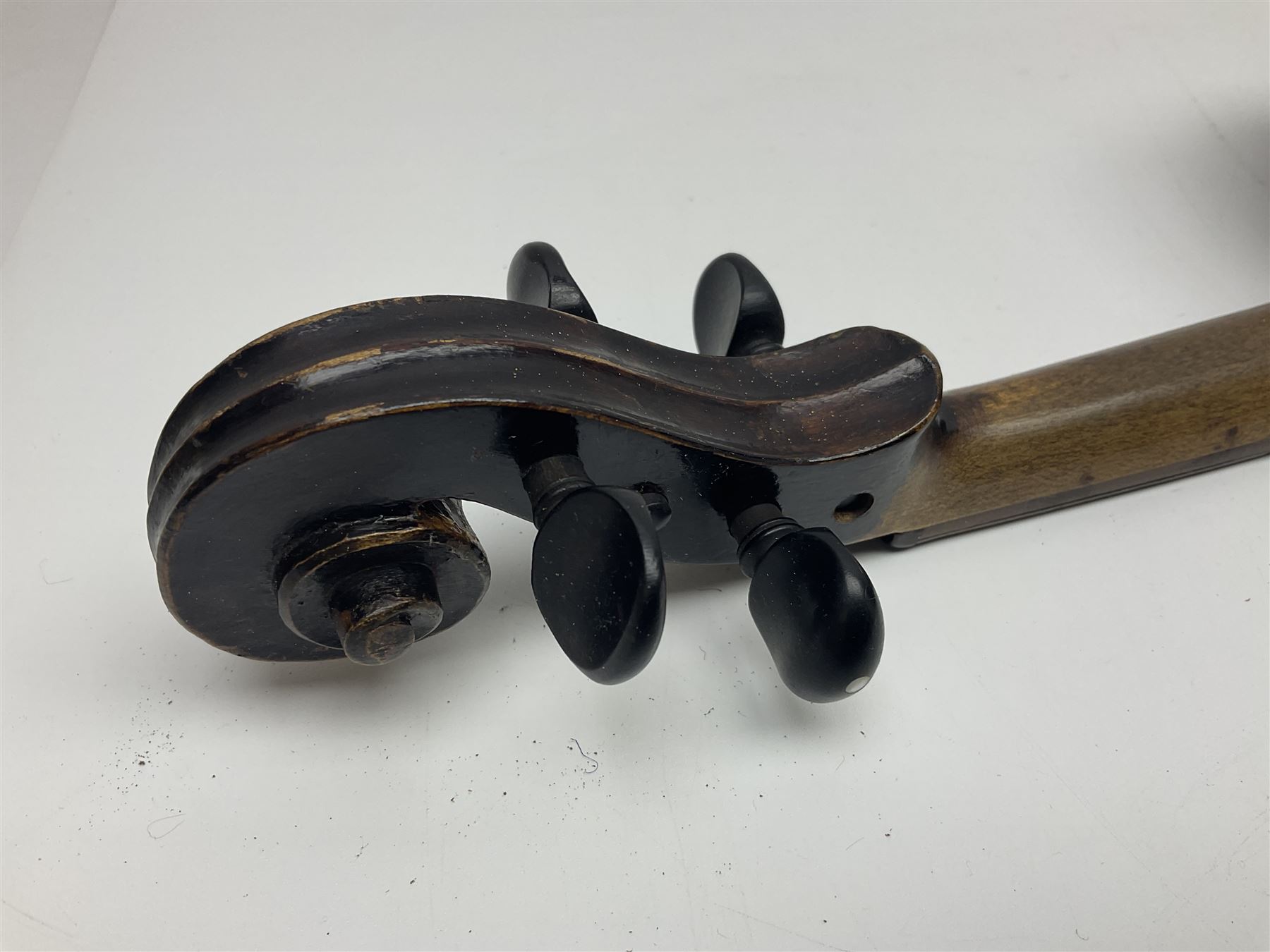 German violin c1890 with 36cm two-piece maple back and ribs and spruce top; bears label 'Antonius Stradivarius Cremona Faciebat Anno 1729' L59.5cm overall; in ebonised wooden 'coffin' case; and two German violins c1890 for completion - one bearing a Stradivarius label, the other a Ruggeri label; both in carrying cases (3)