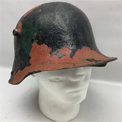 Three battlefield relic helmet shells - WWI German M16; WWI French Adrian; and WWII British (3)