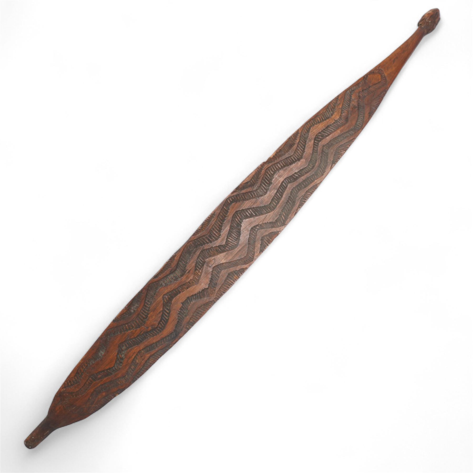 Large African treen grain spoon L62cm; carved wood Berber Tuareg tent peg, West African painted tribal mask 95cm and an Aboriginal wood panel carved with emus and snakes, possibly a bull roarer L82cm (4)