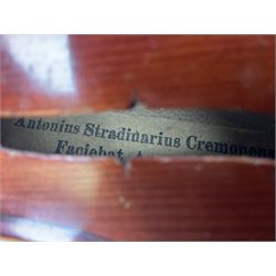 Late 19th century French three-quarter size 'Conservatory' violin with 34cm two-piece maple back and ribs and spruce top, the peg box inscribed 'Conservatory Violin Straduari', bears label 'Antonius Stradiuarius Cremonensis Faciebat Anno 1721' L55.5cm overall; in ebonised wooden 'coffin' case; and Saxony violin c1900 with 36cm two-piece maple back and ribs and spruce top; bears label 'Antonius Stradivarius Cremonensis Faciebat Anno 17**' L59cm overall; in carrying case (2)