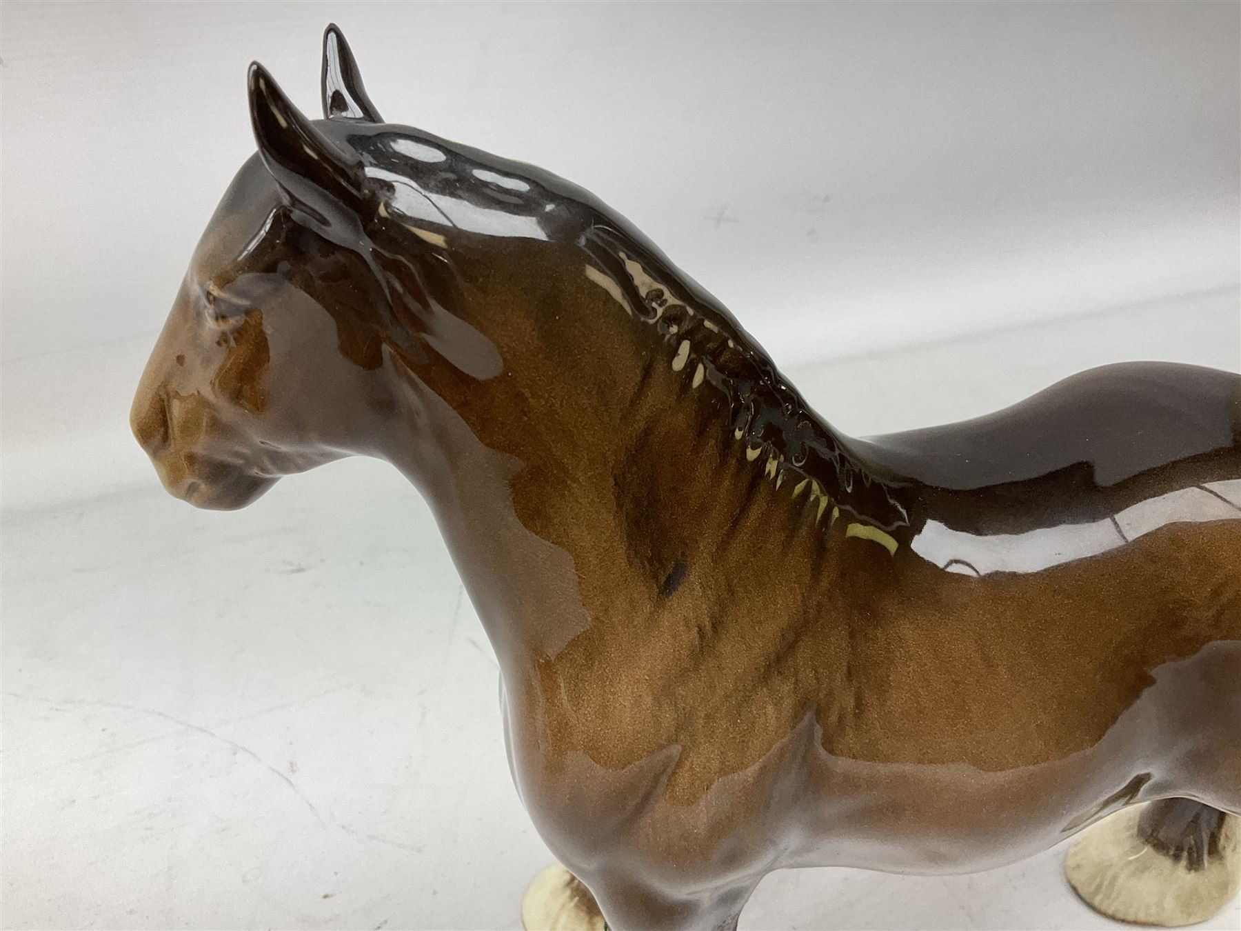 Three Beswick models comprising Hereford Bull no 949, 'CH Cutmil Cupie' Pug, and bay Shire horse, all with printed marks beneath