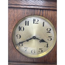 Early 20th century Arts and Crafts oak cased wall clock, circular silvered Arabic dial, twin train movement striking on coil, H69cm