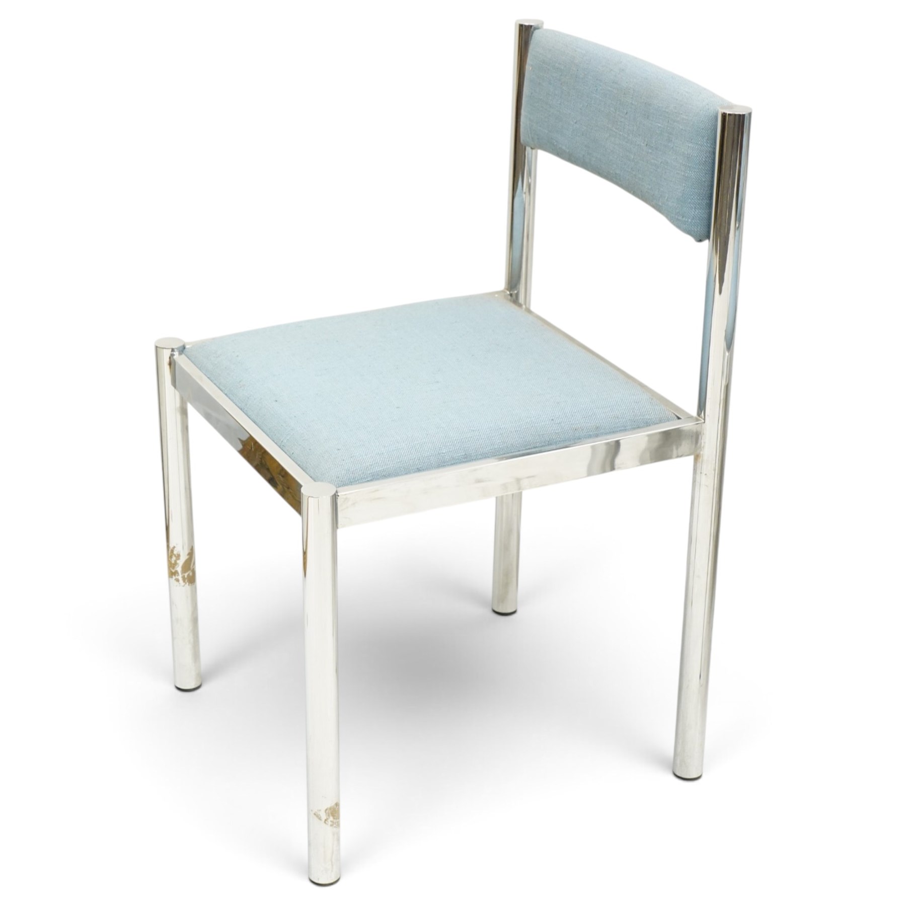 Set of eight 1980s chrome and upholstered dining chairs, curved back bar over padded seats upholstered in blue fabric, on tubular chrome frames