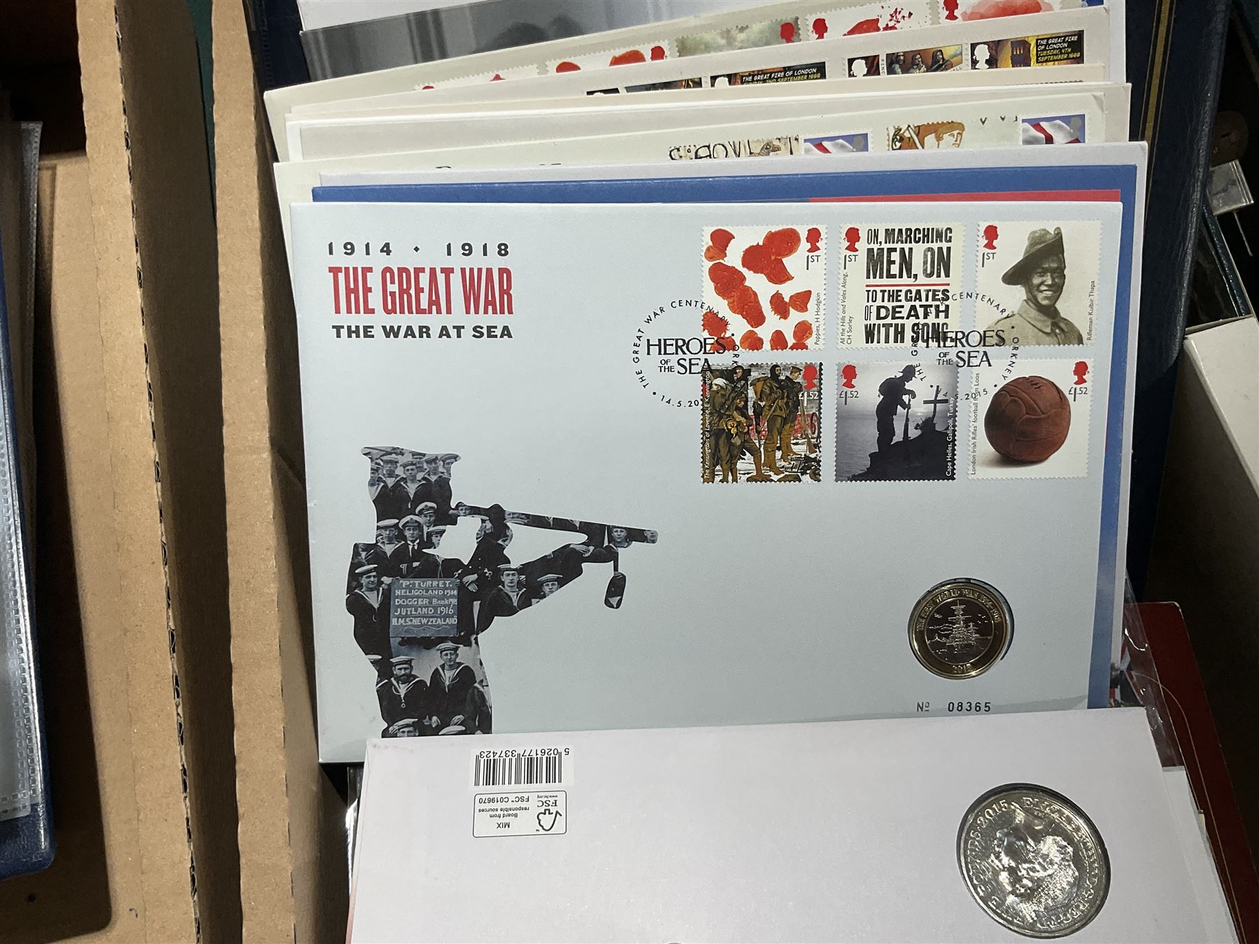 Approximately one hundred and fifteen Royal Mint coin covers, in two ring binder folders and loose, together with approximately 53 grams of Great British pre-1920 and approximately 68 grams of Great British pre-1947 silver threepence coins, and a small quantity of further pre-decimal coins