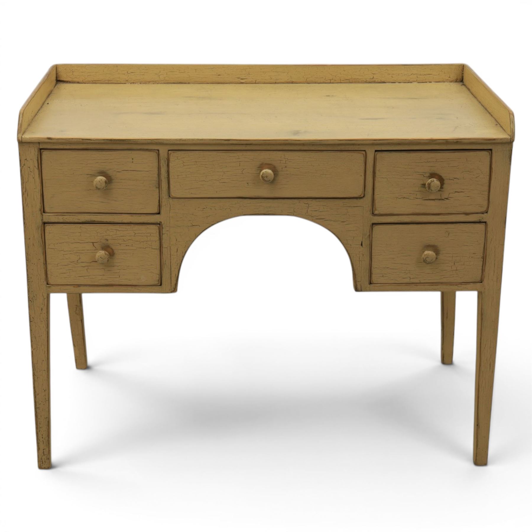Pine country writing desk, rustic cream paint finish, galleried top over a central drawer flanked by two drawers, tapered square supports
