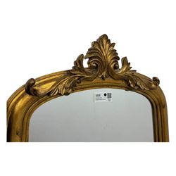Narrow Victorian design gilt framed wall mirror, anthemion and scrolled acanthus leaf pediment over moulded frame, plain mirror plate 